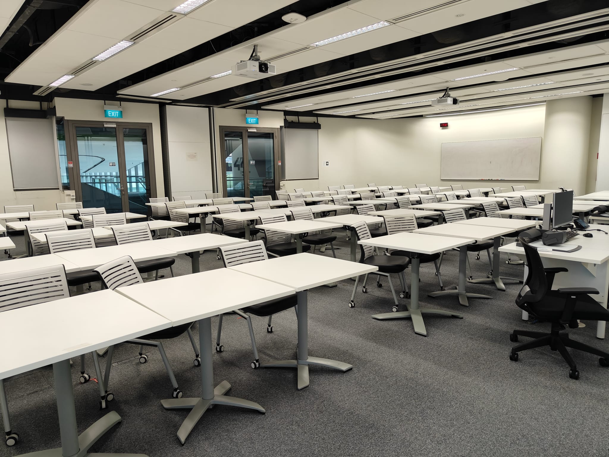 Think Tank meeting room with classroom-style tables, chairs and projection equipment